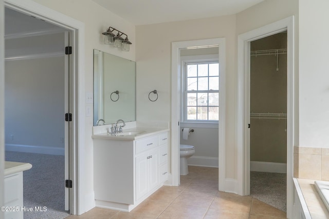 111 Wingate Dr, New Bern, NC 28562 - full bath with toilet, tile patterned flooring, vanity, and a spacious closet