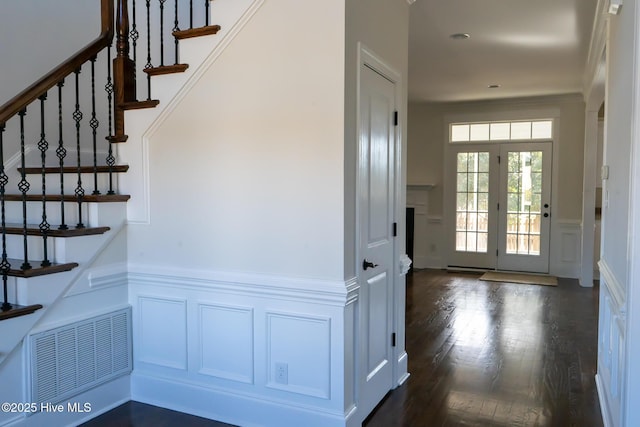 111 Wingate Dr, New Bern, NC 28562 - stairs featuring a decorative wall, a wainscoted wall, visible vents, and wood finished floors