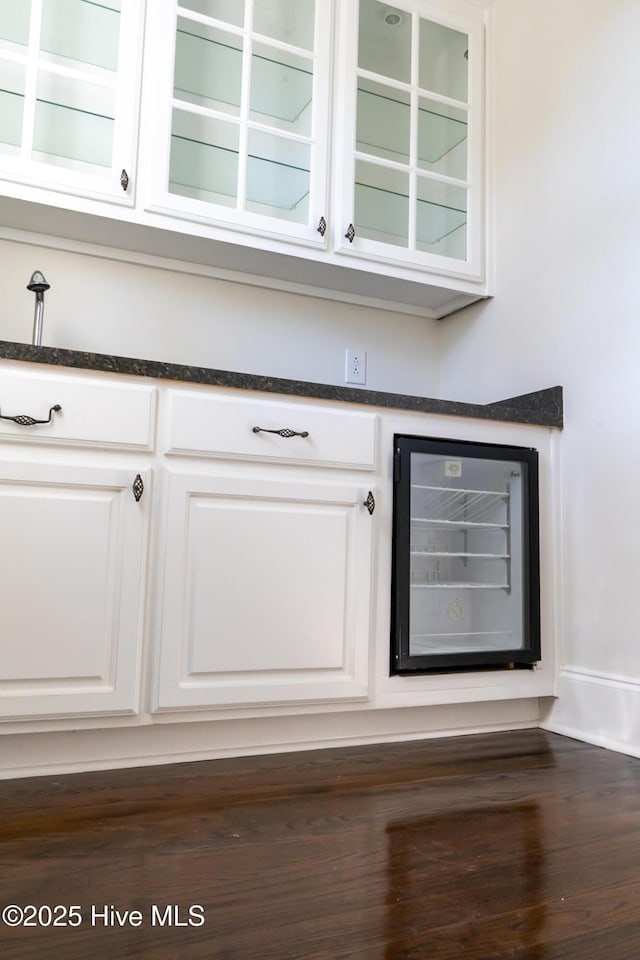 111 Wingate Dr, New Bern, NC 28562 - bar with beverage cooler, dark wood-type flooring, and baseboards