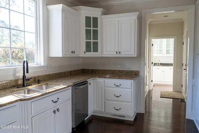 kitchen featuring stainless steel dishwasher, glass insert cabinets, ornamental molding, white cabinets, and a sink