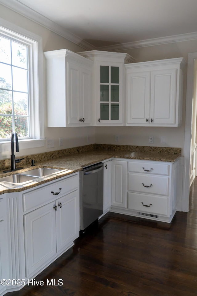 kitchen featuring dark wood-style flooring, a sink, white cabinetry, ornamental molding, and dishwasher