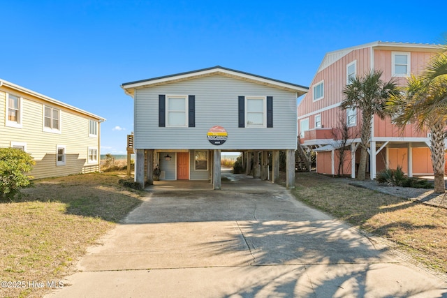 beach home with driveway and a carport