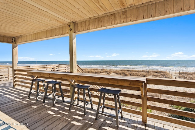 view of home's community featuring a beach view and a water view