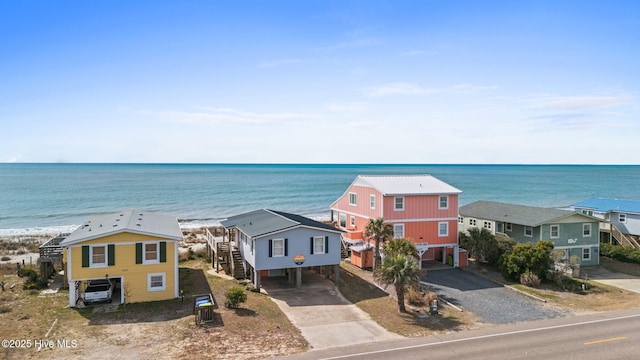 birds eye view of property featuring a water view and a residential view