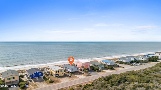 aerial view featuring a water view, a residential view, and a beach view