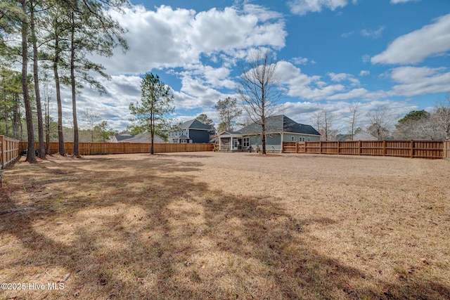 view of yard with a fenced backyard