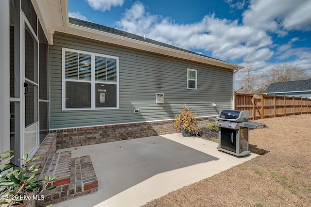 back of property with a patio area and fence