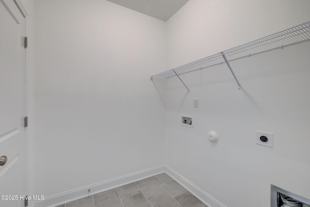 washroom featuring laundry area, baseboards, hookup for a gas dryer, hookup for a washing machine, and electric dryer hookup