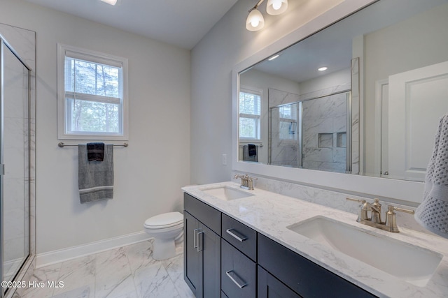 full bath with plenty of natural light, a sink, and baseboards