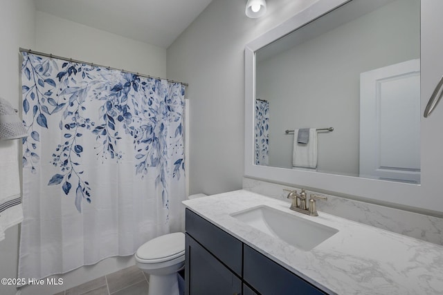 bathroom featuring shower / bath combination with curtain, vanity, toilet, and tile patterned floors