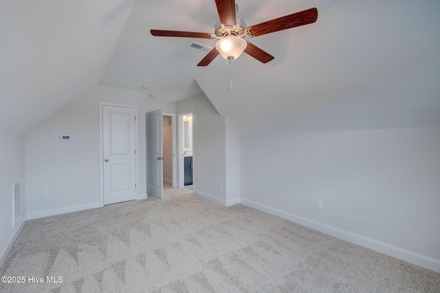 bonus room with light carpet, visible vents, and baseboards