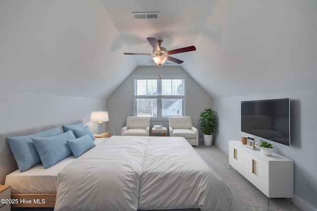 bedroom featuring lofted ceiling, light carpet, visible vents, baseboards, and a ceiling fan