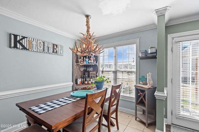 dining area with crown molding, light tile patterned floors, and a healthy amount of sunlight