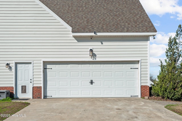 garage featuring driveway