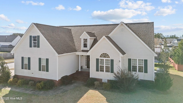 view of front of property with a shingled roof and crawl space