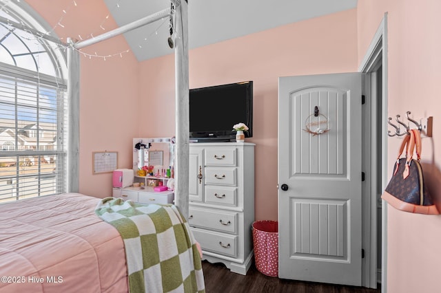 bedroom with dark wood finished floors