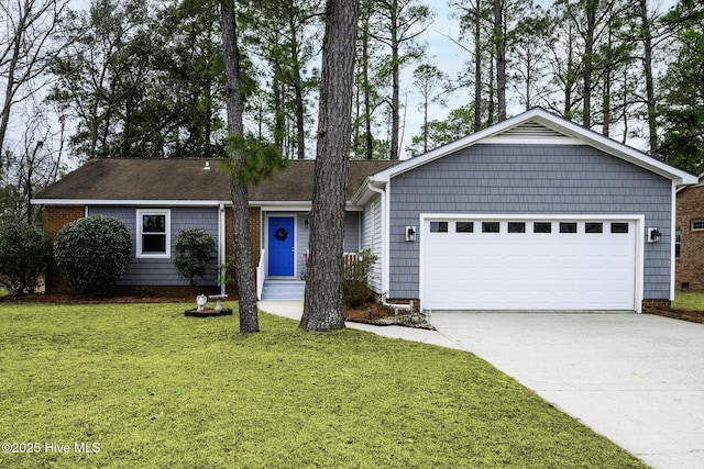 ranch-style home with a garage, concrete driveway, and a front yard