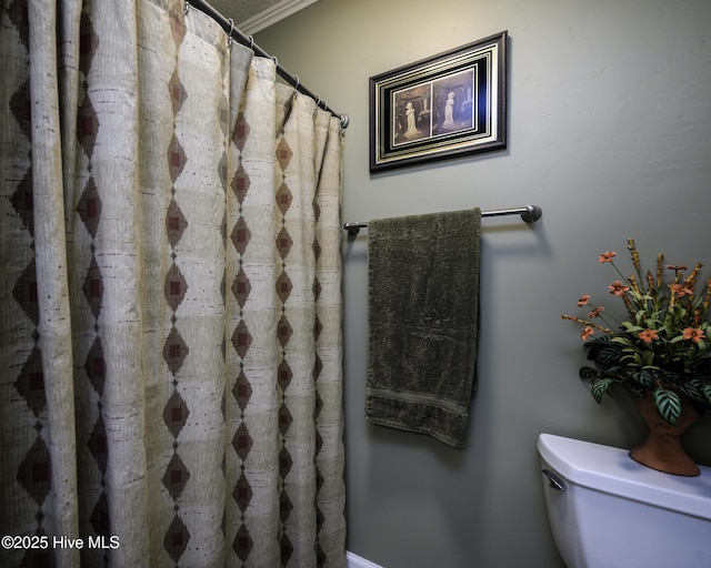 full bathroom with a shower with curtain and toilet