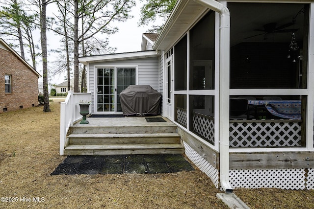 wooden terrace with grilling area and a sunroom