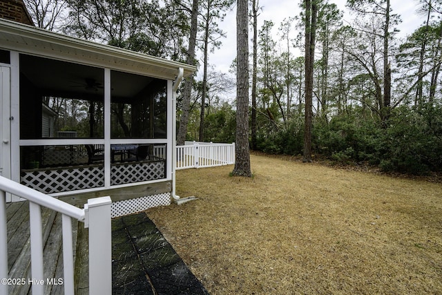 view of yard with a sunroom