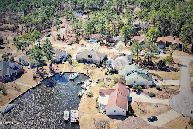 bird's eye view featuring a residential view and a water view