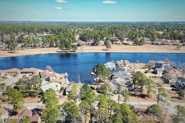 drone / aerial view with a residential view and a water view