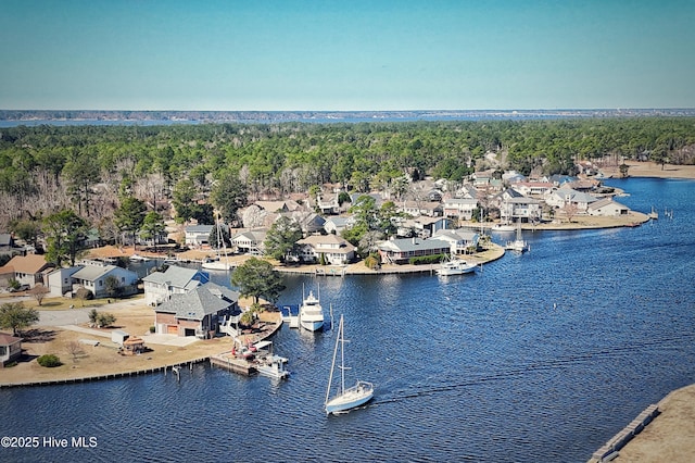 drone / aerial view featuring a water view and a residential view