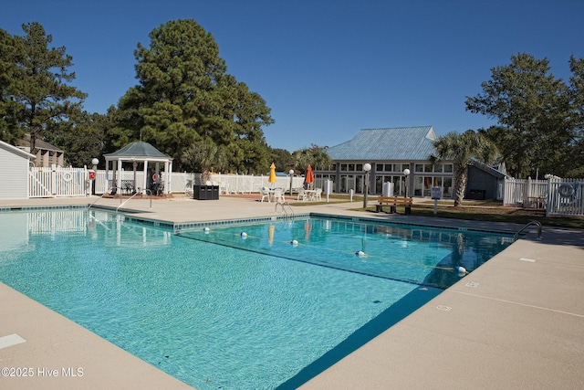 pool featuring a gazebo, a patio, and fence