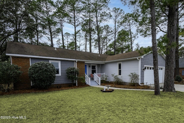 single story home with a front lawn, a garage, and driveway