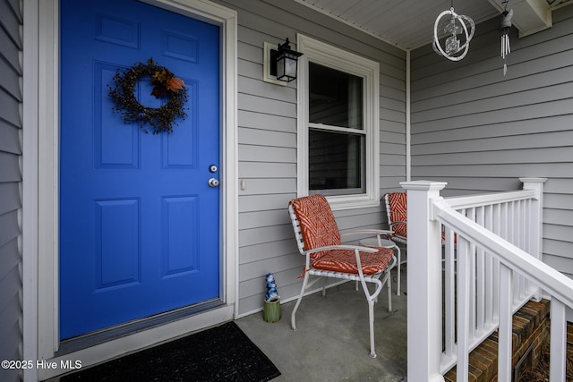 doorway to property featuring covered porch