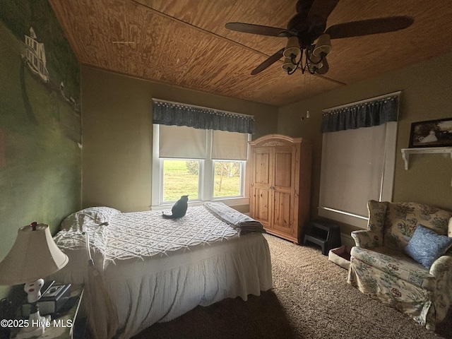 bedroom with wooden ceiling, carpet flooring, and ceiling fan