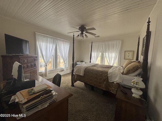 bedroom with wooden ceiling, a ceiling fan, ornamental molding, and carpet flooring