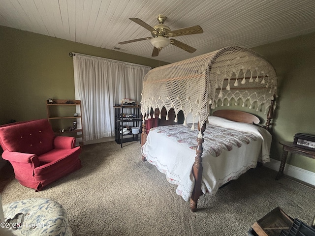 carpeted bedroom featuring wood ceiling, ceiling fan, and visible vents