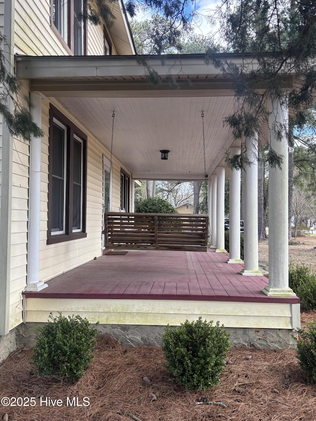 wooden deck featuring covered porch