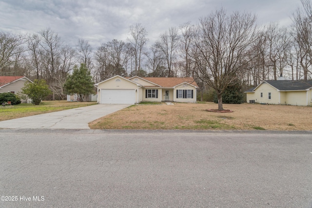 single story home with a garage, concrete driveway, and a front yard