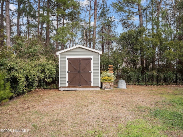 view of shed with fence