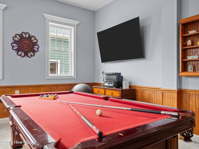 rec room with carpet, a wainscoted wall, and wood walls