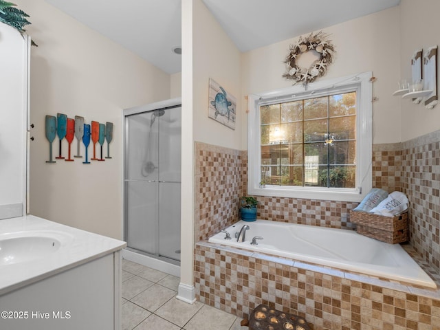 full bathroom with vanity, tile patterned floors, a bath, and a stall shower