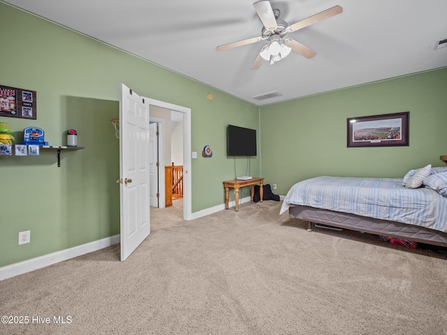 bedroom with visible vents, carpet flooring, baseboards, and ceiling fan