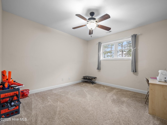 interior space with visible vents, baseboards, ceiling fan, and carpet flooring