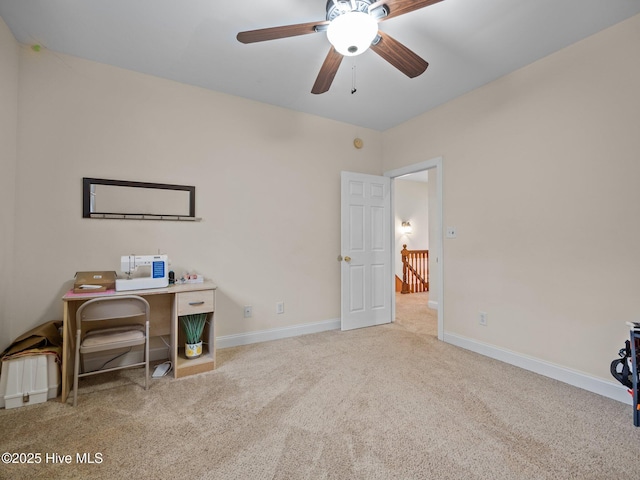 office featuring carpet flooring, baseboards, and a ceiling fan