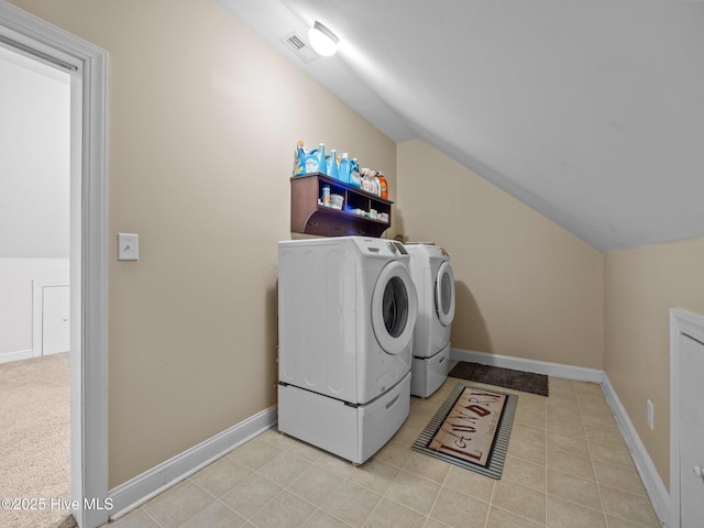 laundry area featuring visible vents, baseboards, laundry area, and washer and clothes dryer