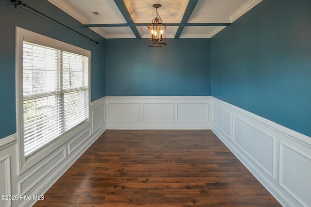 spare room featuring a notable chandelier, dark wood-style flooring, coffered ceiling, visible vents, and beam ceiling