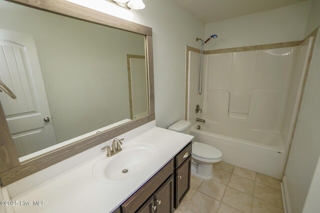 full bathroom with toilet, tile patterned flooring, shower / washtub combination, and vanity