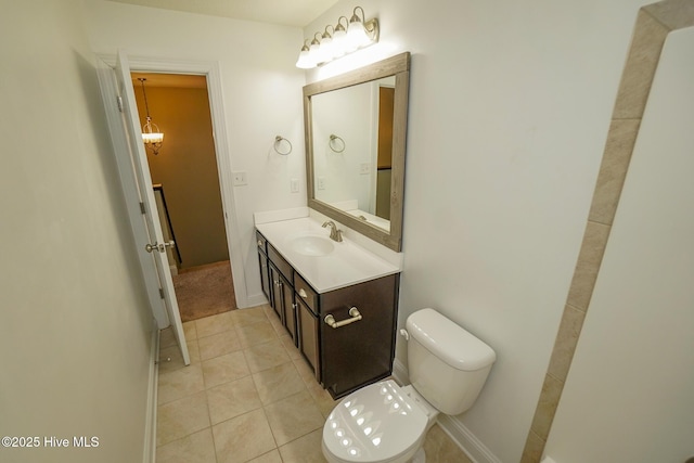 bathroom with vanity, toilet, and tile patterned floors