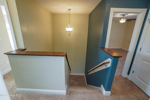 stairs with carpet and baseboards