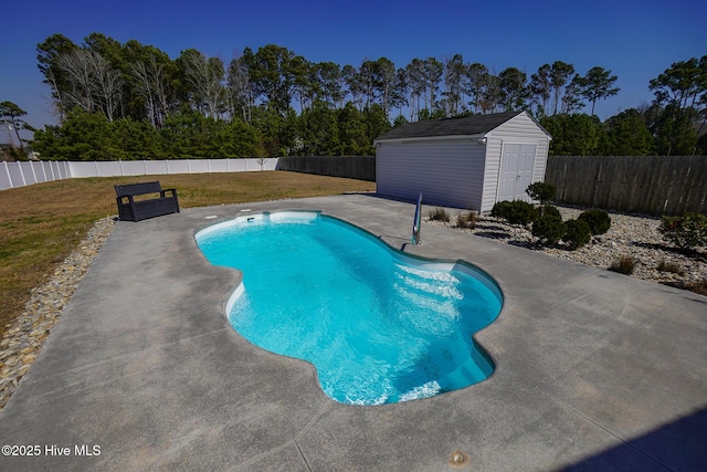 view of swimming pool with a fenced in pool, a fenced backyard, and a yard