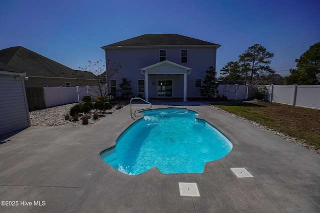 view of pool featuring a fenced in pool, a fenced backyard, and a patio