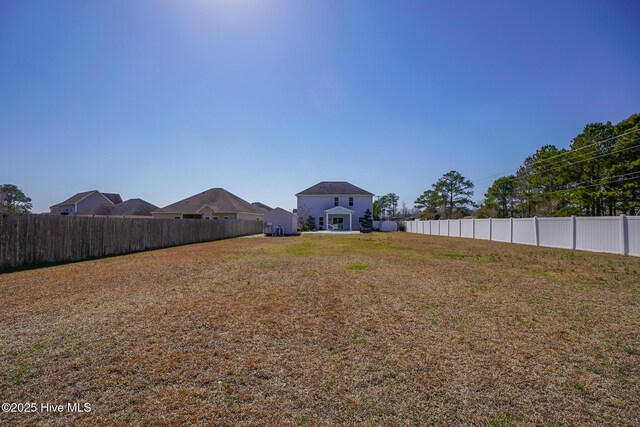 view of yard featuring a fenced backyard