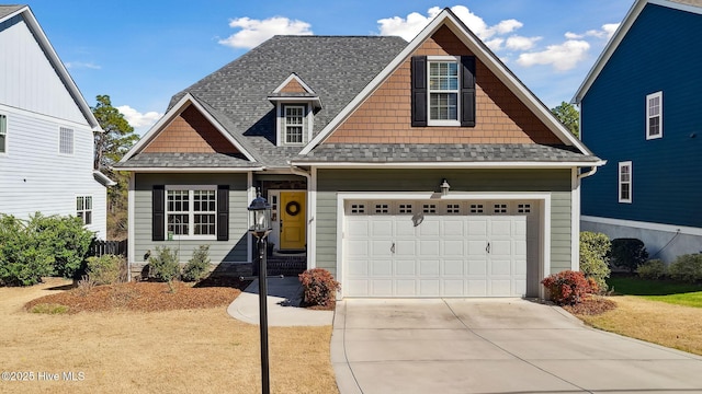 craftsman-style house with a garage, a shingled roof, and concrete driveway